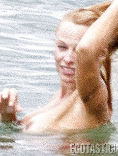 Pamela Anderson Goes Topless on a Beach in France