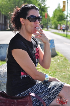 Brunette babe smoking at the park - N