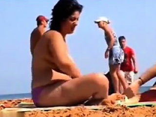 Thick Woman Wth Big Breasts At A Beach