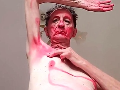 an-old-guy-paints-himself-red-and-dances-nude